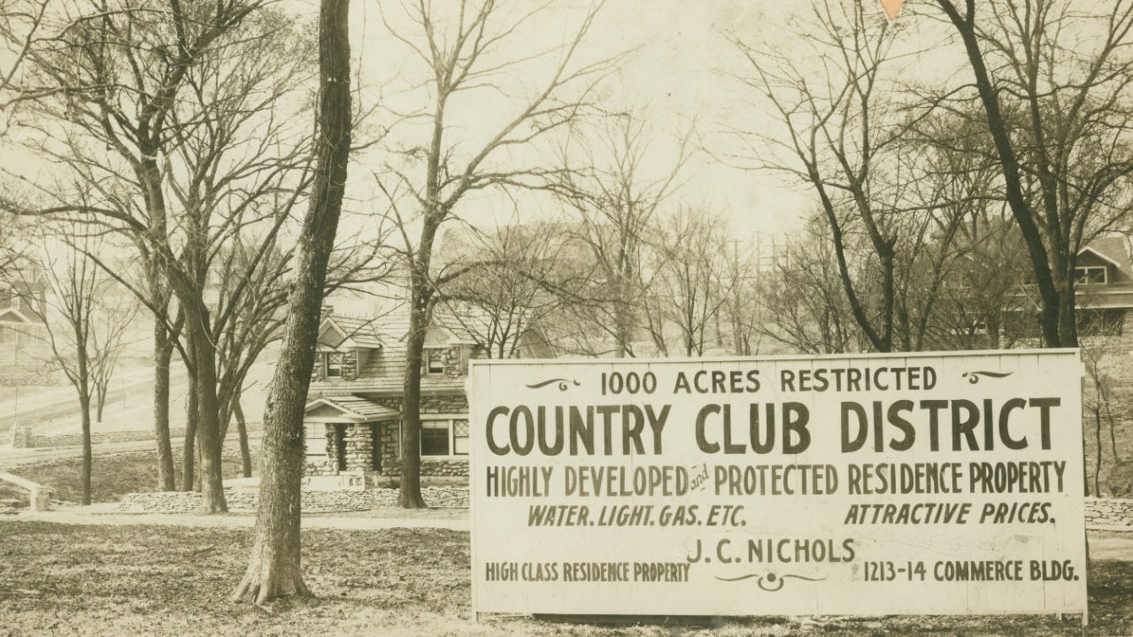 Black and white photo of a sign that reads "1000 acres restricted Country Club District Highly developed and protected residence property. Water, light, gas, etc. Attractive prices. High class residence property. J.C. Nichols. 1213-14 Commerce Bldg."