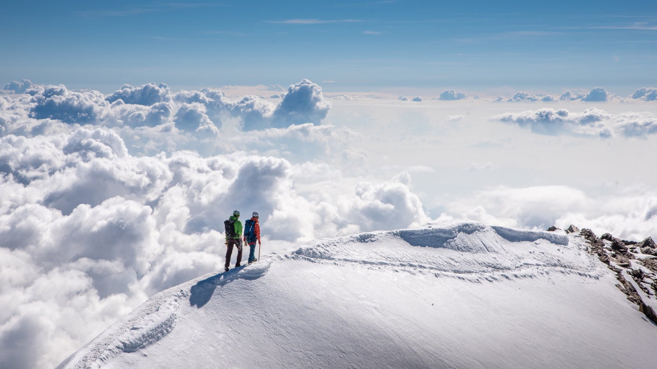 Mountaineers walking on the ridge of Weissmies, Switzerland