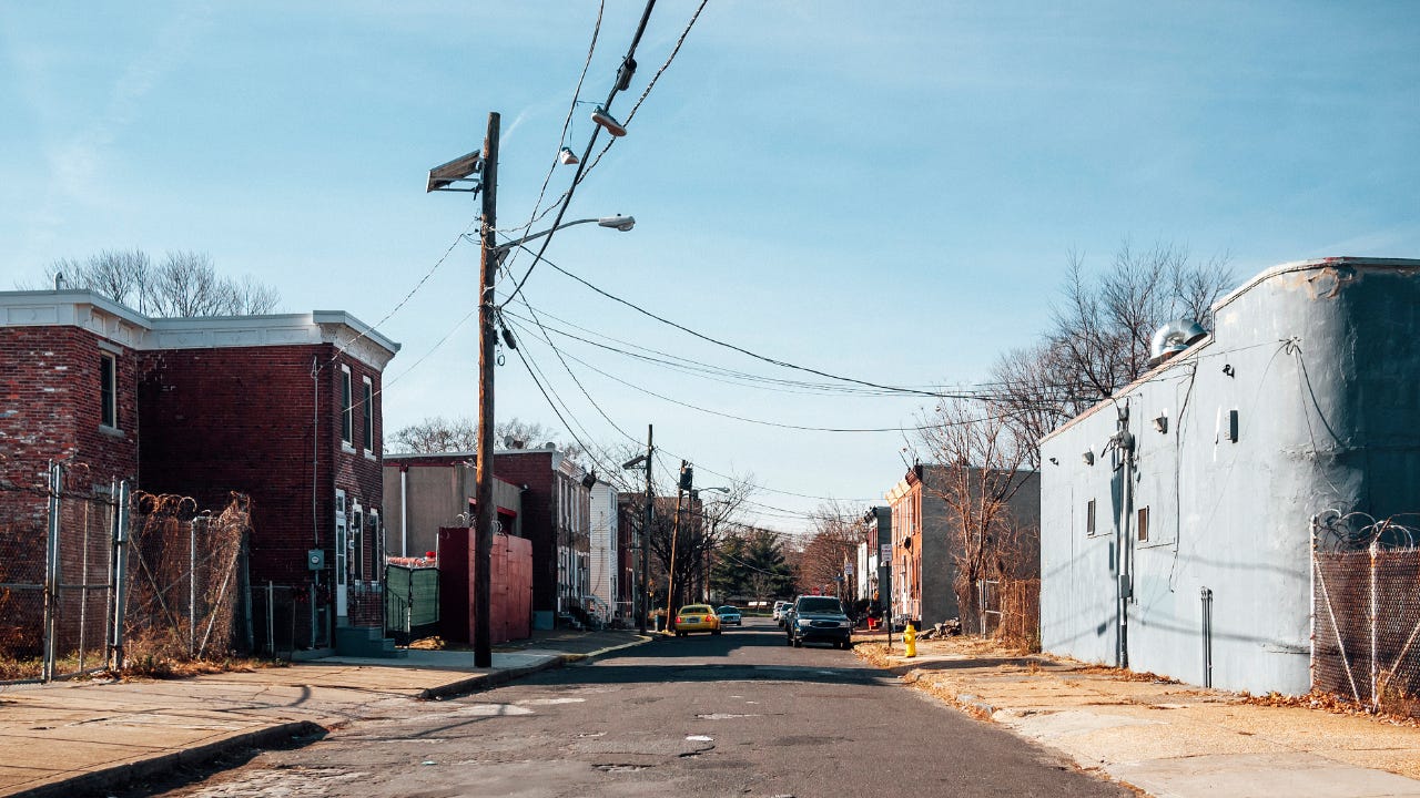 View of a semi-industrial street in a lower-income neighborhood.