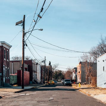 View of a semi-industrial street in a lower-income neighborhood.