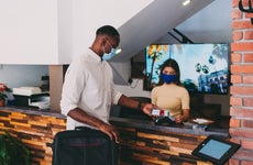 Person paying for hotel with credit card