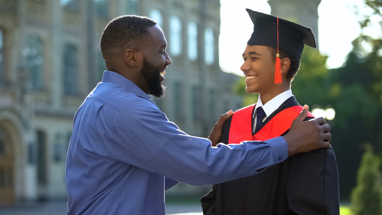 Father and son celebrate at college graduation