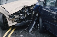 Two damaged cars after crash, close-up