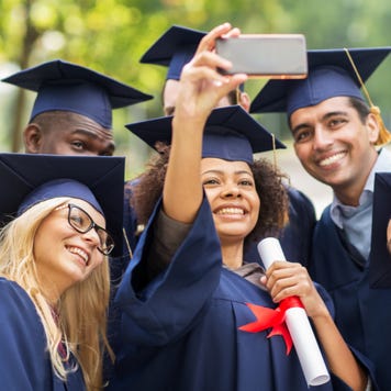 College graduates take a photo together