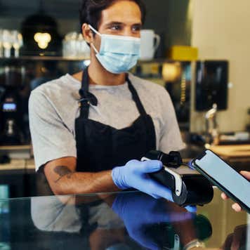 Cashier accepting contactless payment