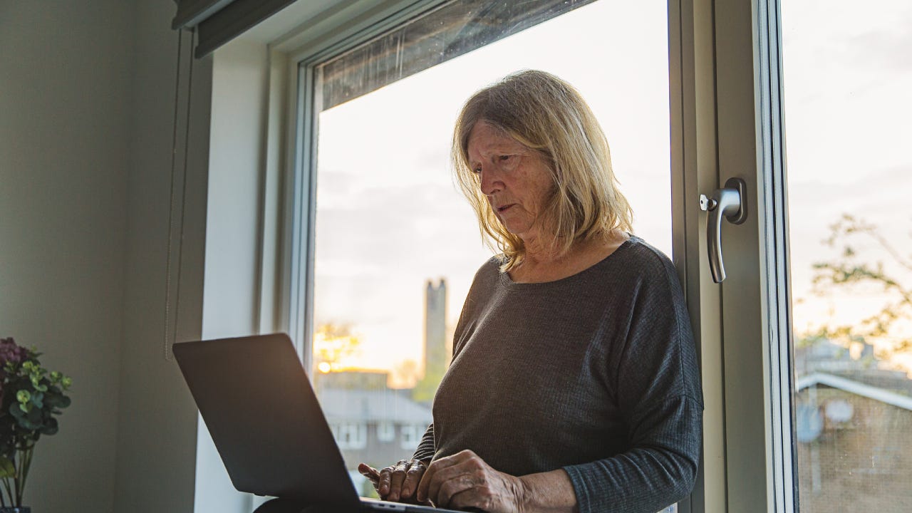 Senior lady on laptop - negative emotion