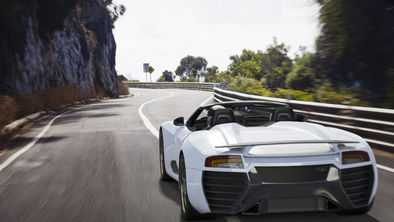 Sports Car on a Coastal Road