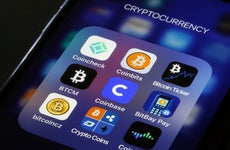 A picture of a mobile phone screen with cryptocurrency apps