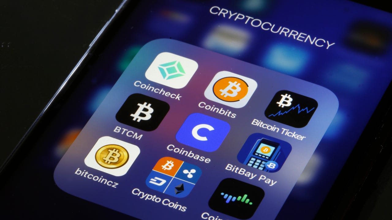 A picture of a mobile phone screen with cryptocurrency apps