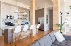 A condo kitchen with a modern open-floor plan