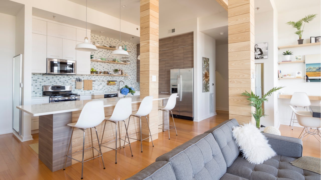 A condo kitchen with a modern open-floor plan