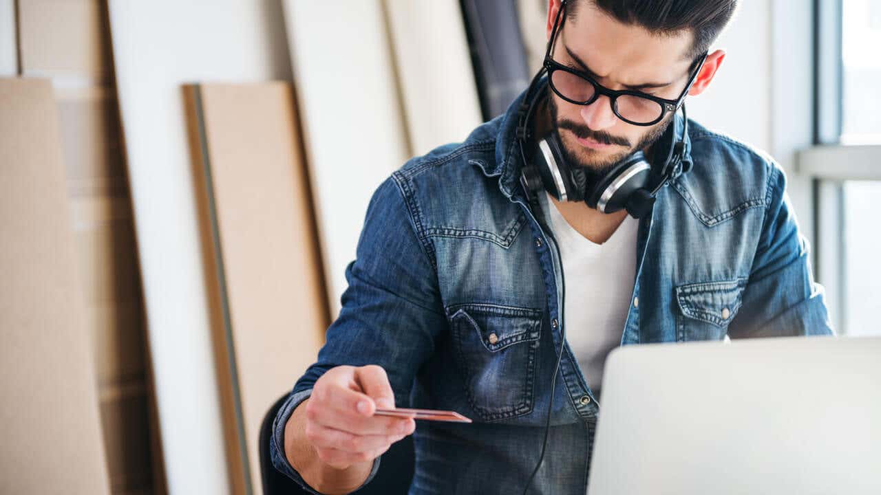 Man shopping online with a credit card