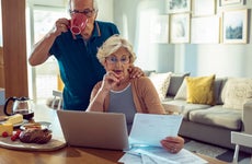 Senior couple reviewing credit card statements