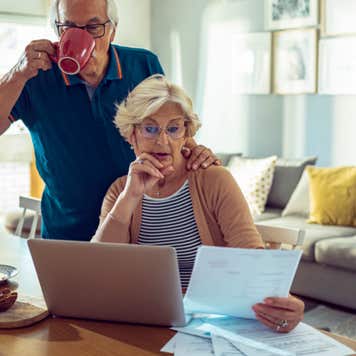 Senior couple reviewing credit card statements