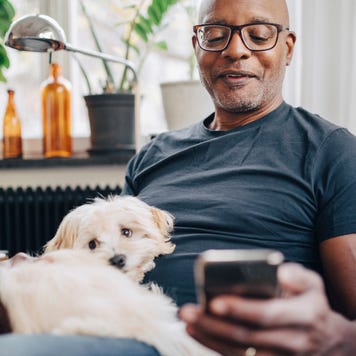 A senior man is on a smartphone.
