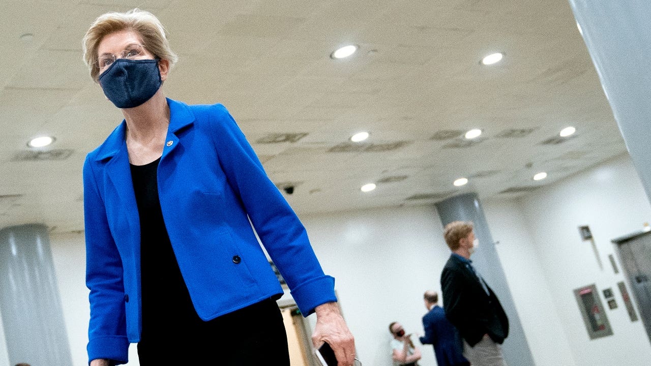 Sen. Elizabeth Warren walks through the Senate Subway
