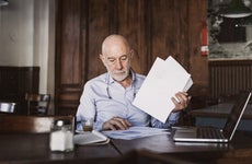 man looking through papers