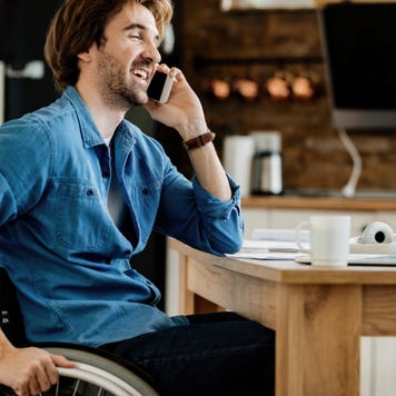 Young man working from home in a wheelchair