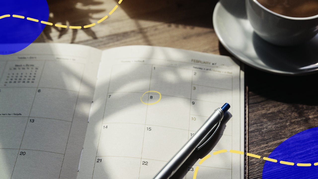 Pen sitting on top of a planner calendar