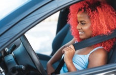 Portrait of afro woman preparing to drive