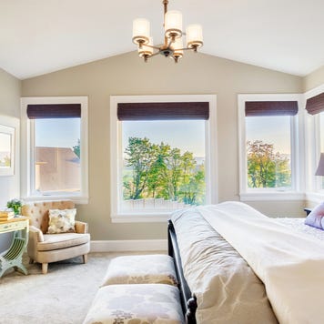 A master bedroom with view outdoors