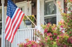 A closeup of the U.S. flag on a single-family home