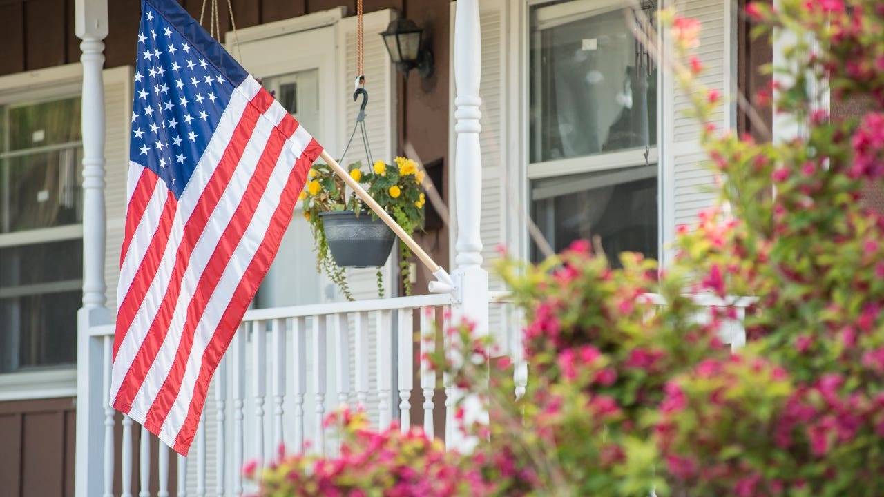 A closeup of the U.S. flag on a single-family home