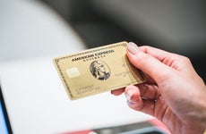 Person holding the Amex Business Gold Card