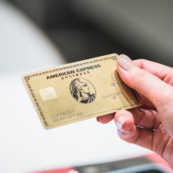 Person holding the Amex Business Gold Card