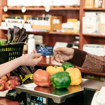 Person paying with Blue Cash Preferred card