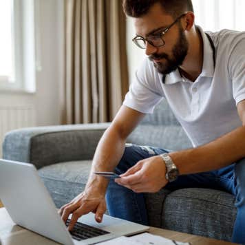 Man with credit card and laptop