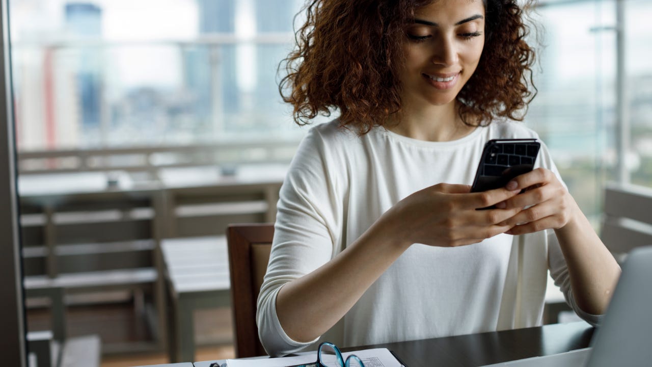 Woman using cellphone.