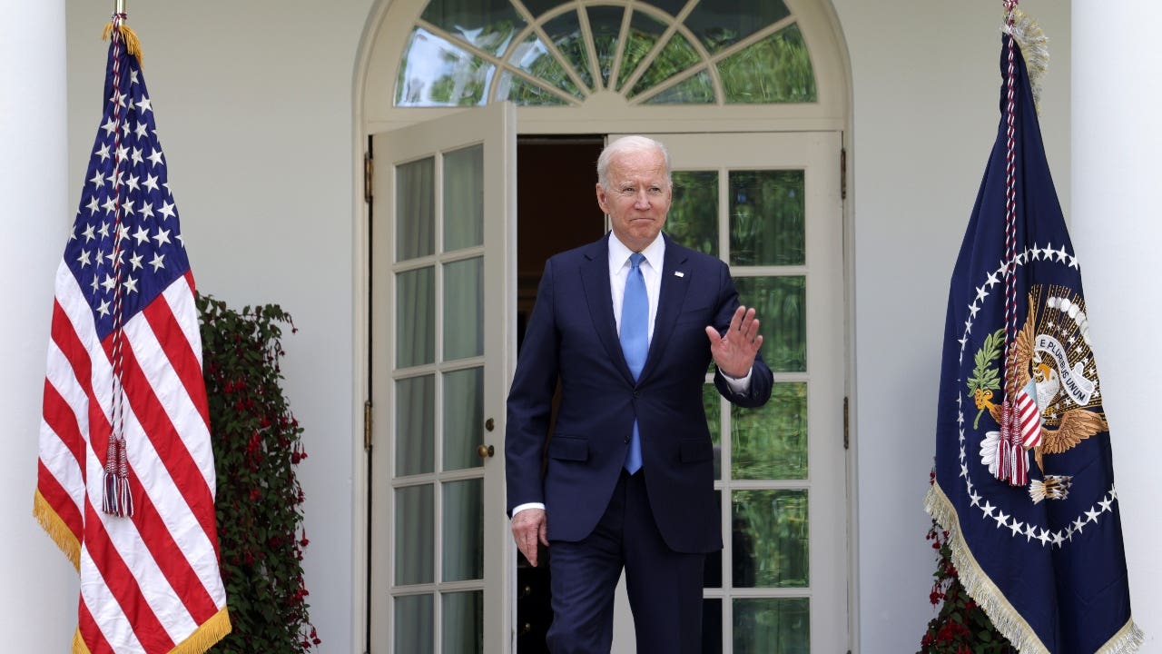 President Biden walks into the Rose Garden