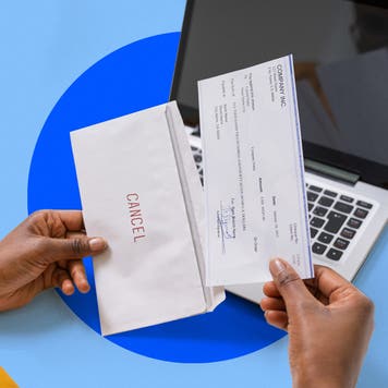 Woman putting a check in an envelope that says cancel