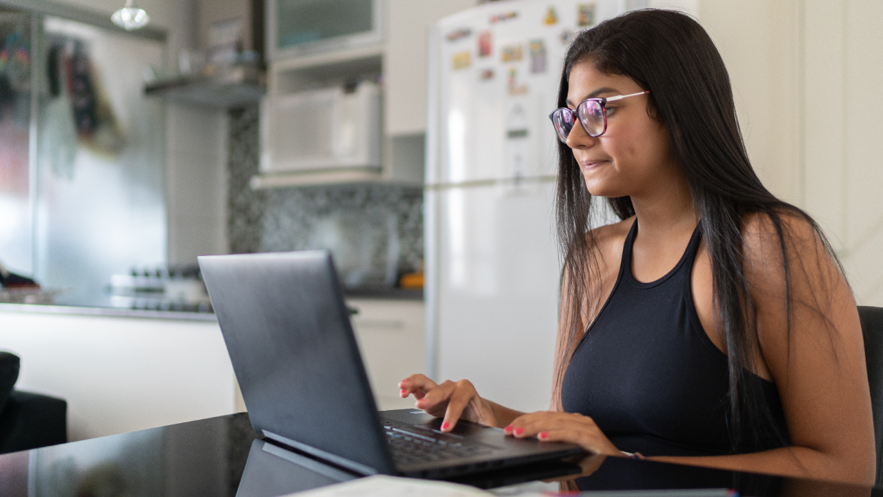 Woman working on her laptop from home