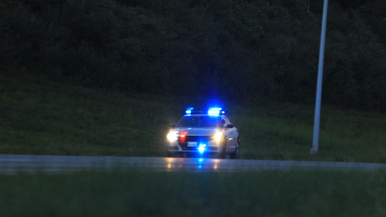 Illuminated police car lights and sirens