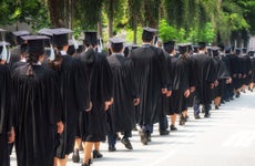 Students line up at a college graduation ceremony