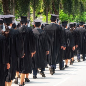 Students line up at a college graduation ceremony