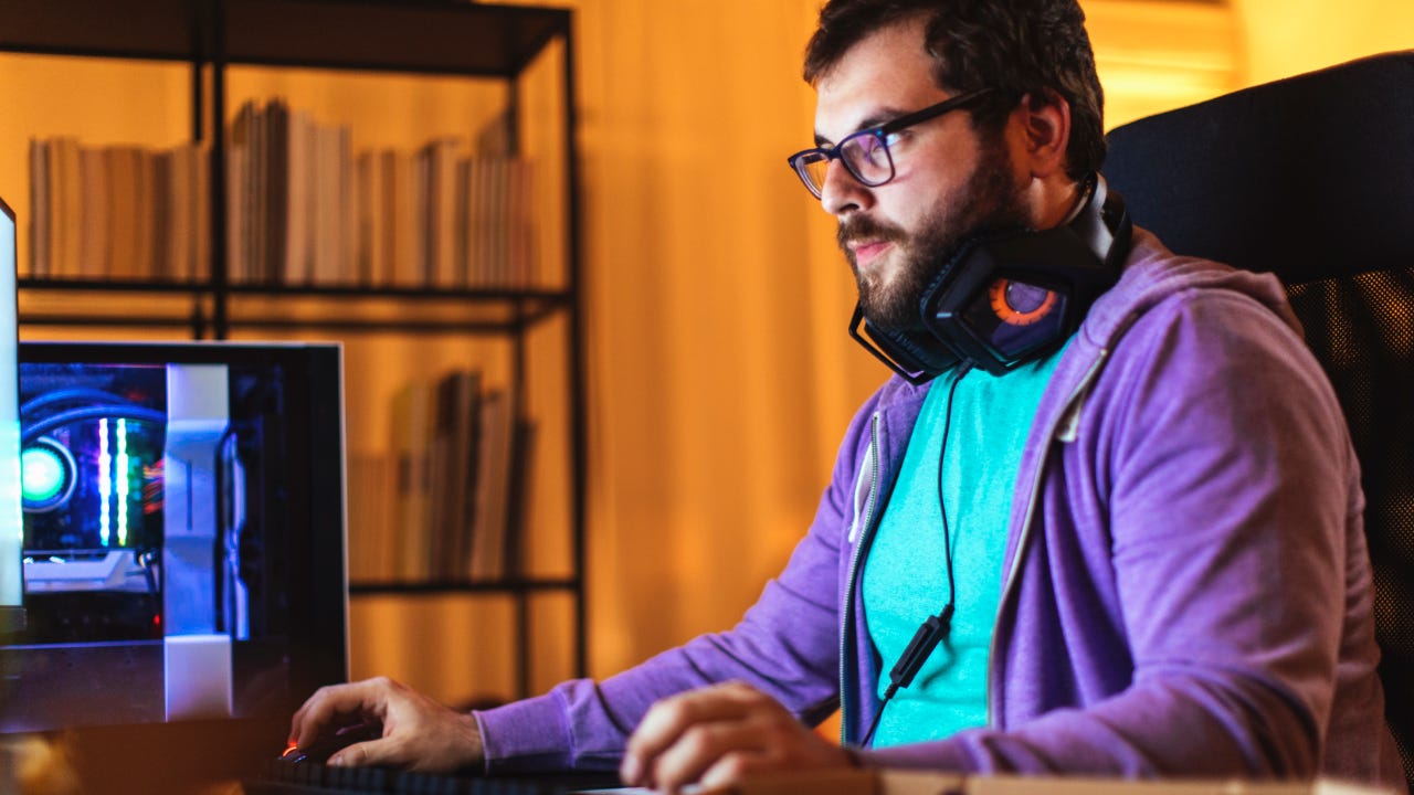 A man sits in front of his computer