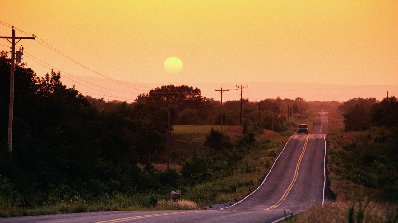 Sunrise over Kiamichi Mountains and Highway 63, between Talihina and Big Cedar.
