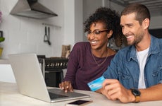 Couple looking at credit card offers on CardMatch