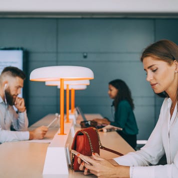 Woman in airport lounge on cellphone