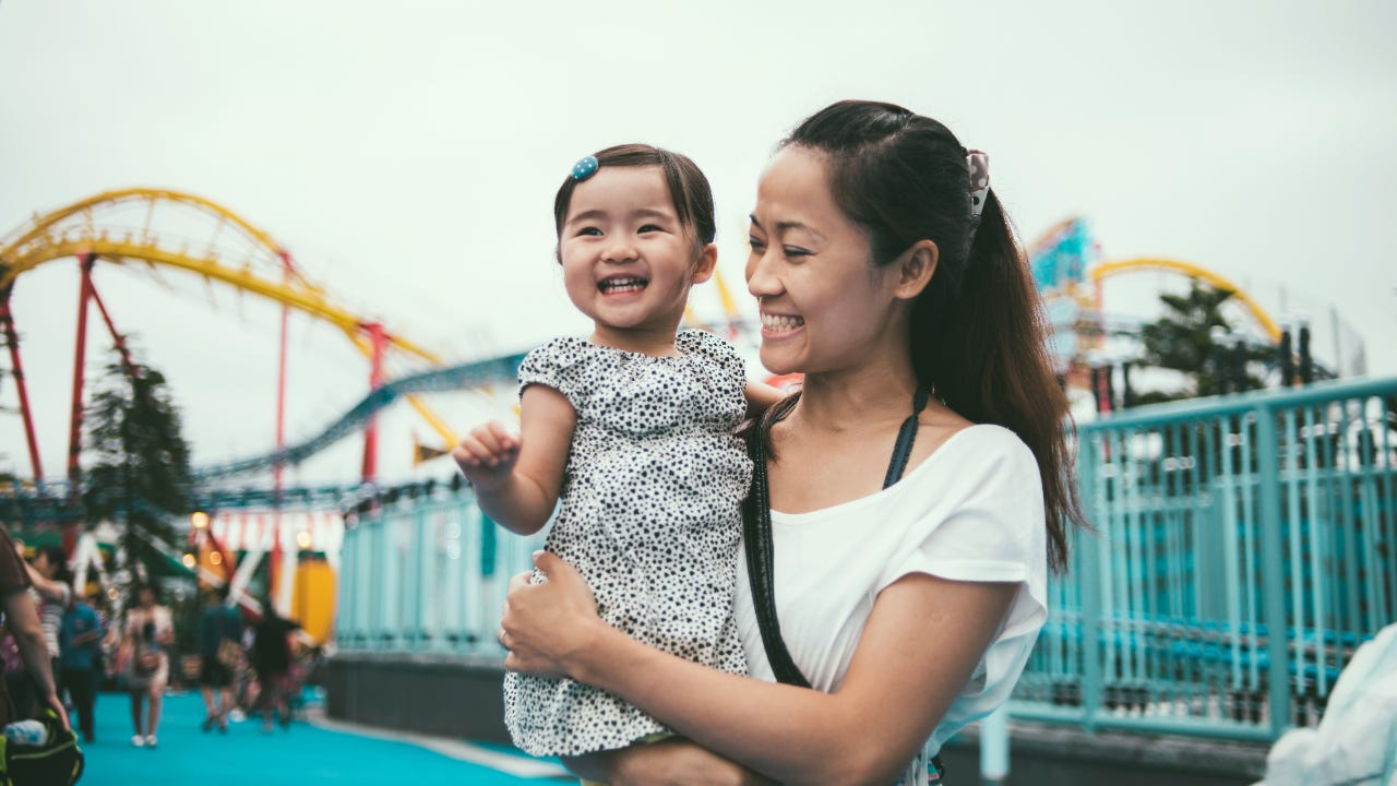 Mother and child at amusement park