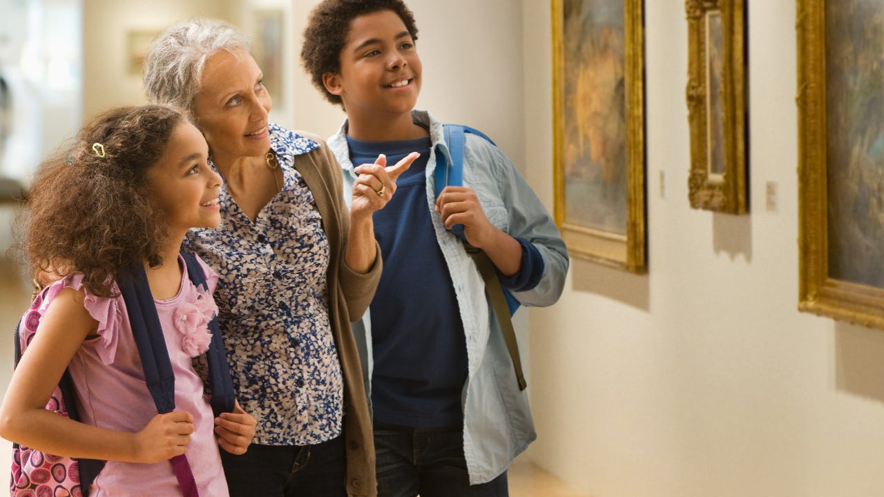 Family looking at art at museum