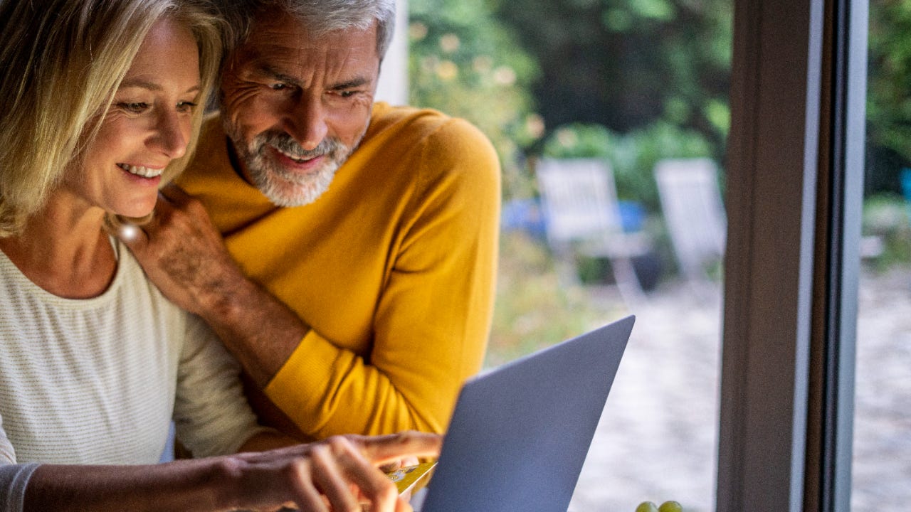 Older couple in front of laptop