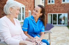 Nurse talks with a woman in a retirement home