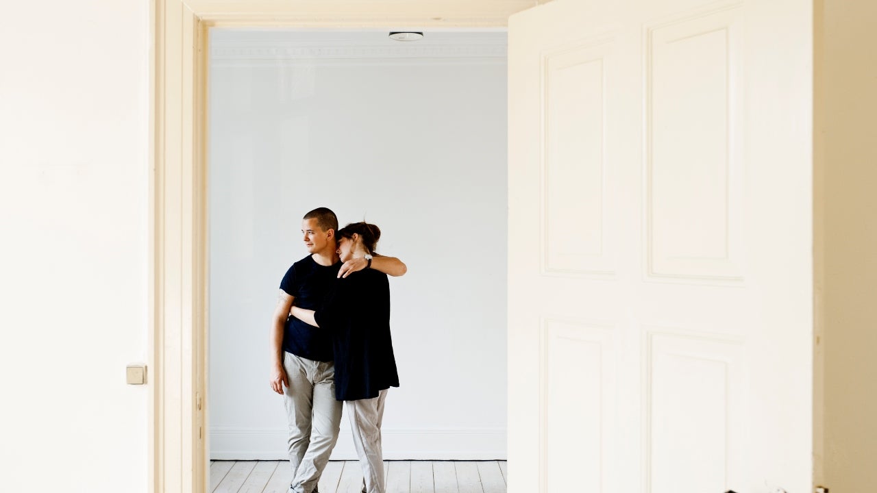A couple embraces in their newly bought home
