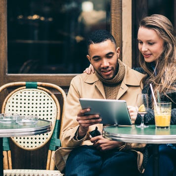 Couple at outdoor cafe.