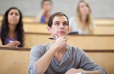 College student sits in a lecture hall