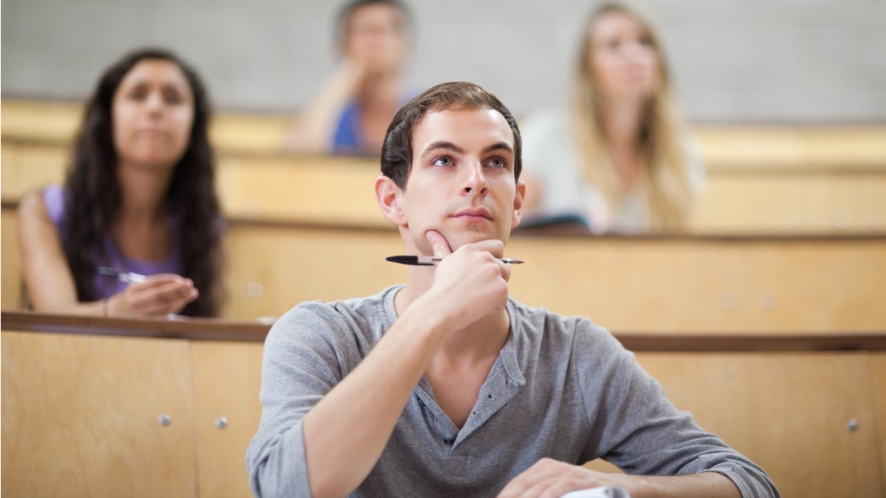 College student sits in a lecture hall